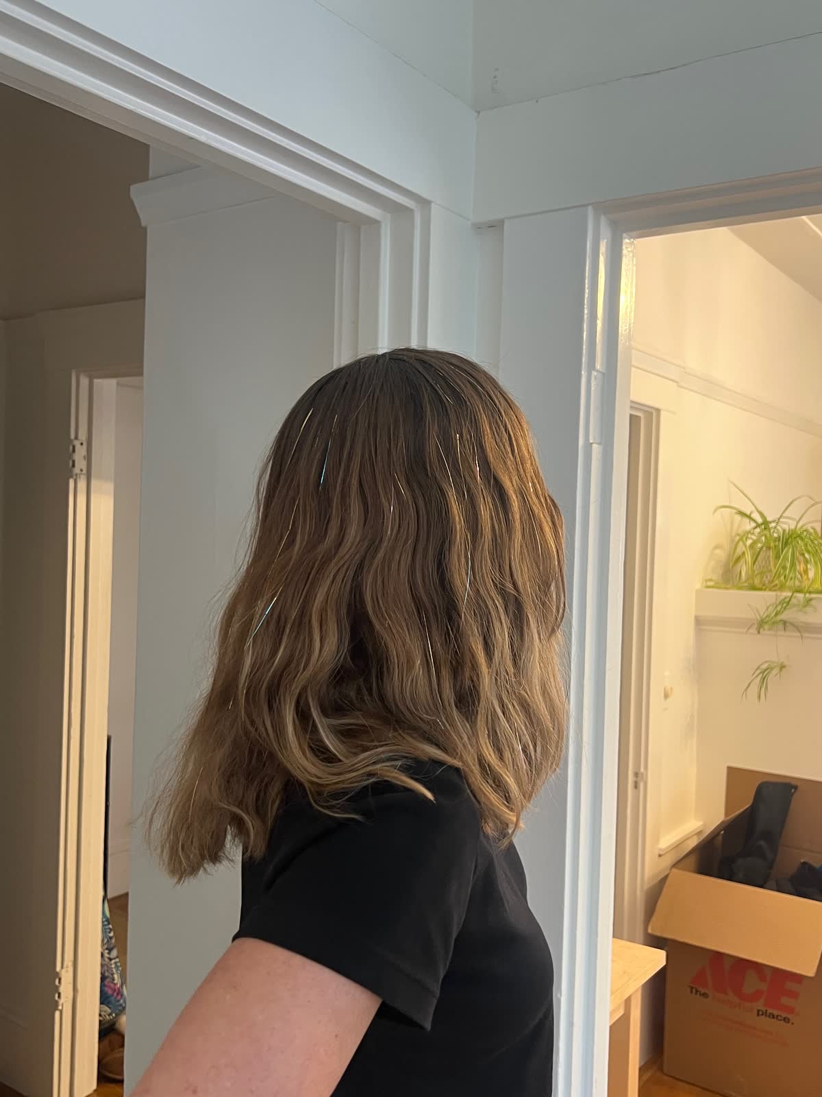 Blonde waves with fine sparkles catching daylight